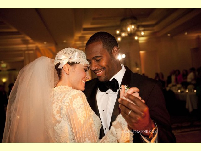 Bride & Groom looking very happy on dance floor