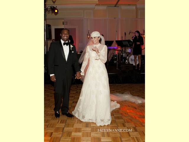 Bride & Groom on dance floor, Stage in back