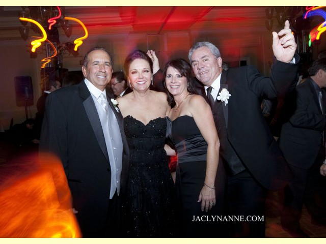 Good looking older people enjoying music on dance floor smiling